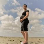 Not Enough Nutrition During Pregnancy Photo of pregnant woman with 'Not Enough Nutrition During Pregnancy' as she eats a healthy meal
