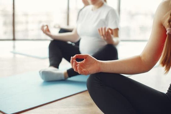 Image of a pregnant woman eating a balanced meal to prevent IMBALANCED NUTRITION IN PREGNANCY