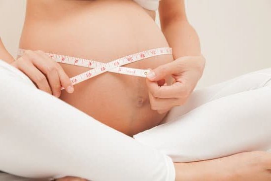 Image showing a woman taking a pregnancy test to check for pregnancy