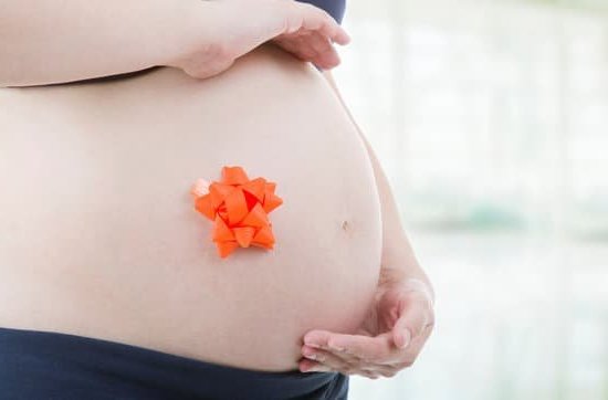 What Is Nesting in Pregnancy Image of a pregnant woman demonstrating nesting behaviors in preparation for childbirth. What is nesting in pregnancy