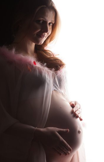 Digital pregnancy test displaying positive result and clear digital screen