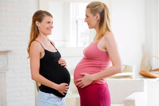 Pregnant woman receiving pregnancy ultrasound to monitor fetus development at medical clinic
