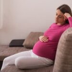 Teenage Pregnancy Teenage girl holding baby, representing the challenges of teenage pregnancy