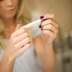 When Do Cravings Start in Pregnancy Image of a pregnant woman experiencing a craving for pickles, illustrating WHEN DO CRAVINGS START IN PREGNANCY