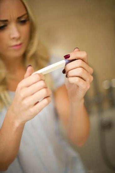 Image of a pregnant woman experiencing a craving for pickles, illustrating WHEN DO CRAVINGS START IN PREGNANCY