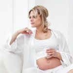 First Month of Pregnancy Symptoms Early signs of nausea, fatigue, and breast tenderness for expectant mothers