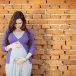 What Is a High Risk Pregnancy Image depicting a woman having a consultation with a doctor about WHAT IS A HIGH RISK PREGNANCY
