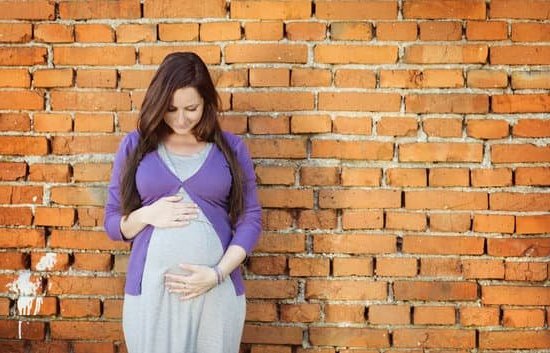 What Is a High Risk Pregnancy Image depicting a woman having a consultation with a doctor about WHAT IS A HIGH RISK PREGNANCY