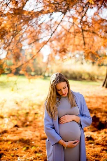 A month pregnancy belly showing slight bump growth, starting to pop out